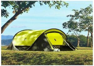 uma tenda amarela num campo com uma bola de futebol em Guest House U Aidy em Novy Afon