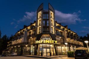 a large building with a sign that reads infinity at SPA Hotel Infinity Park Velingrad in Velingrad