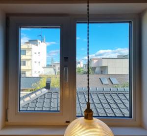a window with a view of a building at Hotel Lana in Gangneung