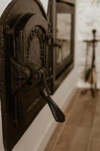 an old fashioned telephone hanging on a wall at El Retiro de la Adrada AVILA in La Adrada