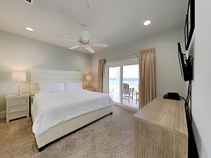 a bedroom with a bed and a view of the ocean at Beach Music in Gulf Shores +45 photos