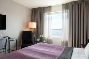 Postel nebo postele na pokoji v ubytování Elite Plaza Örnsköldsvik