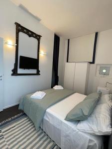 A bed or beds in a room at Attico Baylle