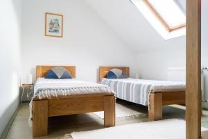 Posteľ alebo postele v izbe v ubytovaní AllOne apartman
