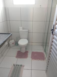 Ванная комната в Sua casa no litoral