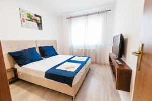 เตียงในห้องที่ Apartment Stari Pazar