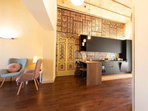 a kitchen and living room with a table and chairs at The Best Rent - Elegant two-bedroom apartment close to Saint Peter's Basilica in Rome