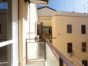 a balcony with a view of a building at The Best Rent - Elegant two-bedroom apartment close to Saint Peter's Basilica in Rome