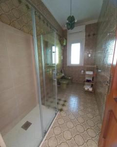 a bathroom with a shower and a toilet at Tenuta Aquilae in Castrofilippo