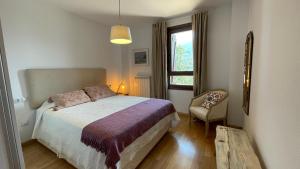 Säng eller sängar i ett rum på C15 - Apartamento gran terraza Aigualluts - Villmor
