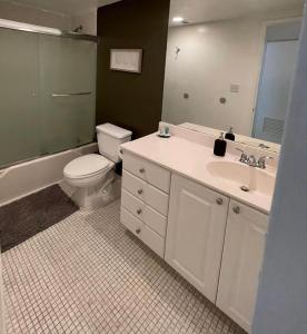 a bathroom with a toilet and a sink at Ocean Reserve 207 - STR 2270 in Miami Beach