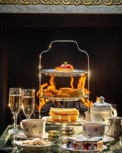 a table with a cake and glasses of wine at San Domenico House in London
