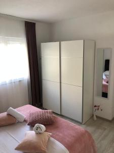 Posteľ alebo postele v izbe v ubytovaní Apartman MIR