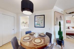 a dining room with a wooden table and chairs at 1099 Desert Dream in Phoenix