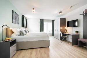 Postel nebo postele na pokoji v ubytování Snooze Apartments Alling