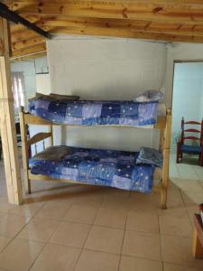 Postel nebo postele na pokoji v ubytování Cabañas Aires de la quebrada - Mendoza