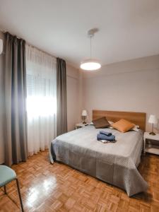 Posteľ alebo postele v izbe v ubytovaní TIP TOP apartment