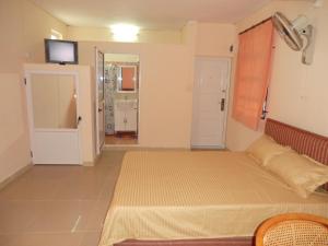 Postel nebo postele na pokoji v ubytování Auberge Les Lilas
