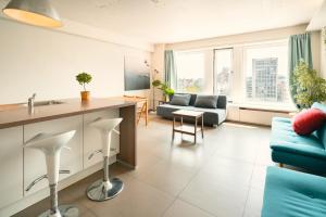 Μια τηλεόραση ή/και κέντρο ψυχαγωγίας στο Aspen Lodge in the Center of Antwerp