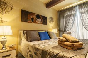 Кровать или кровати в номере Ajuga Luxury Boutique B&B