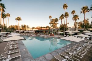 a beach with a lot of palm trees at Andaz Scottsdale Resort & Bungalows in Scottsdale