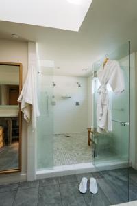 a bathroom with a shower, sink, and toilet at Andaz Scottsdale Resort & Bungalows in Scottsdale