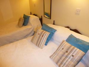 Postel nebo postele na pokoji v ubytování Ben View Guesthouse