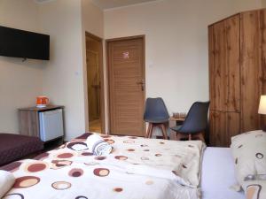 Ένα ή περισσότερα κρεβάτια σε δωμάτιο στο Noclegi Strzelec Karpacz
