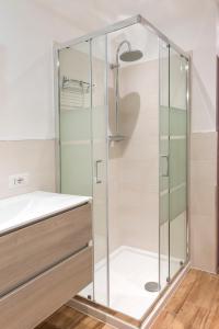 a shower with a glass door in a bathroom at N255 - Numana, trilocale con aria condizionata in Marcelli