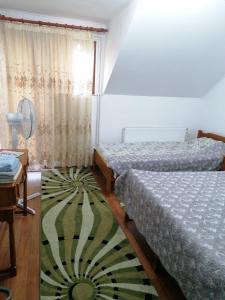 A bed or beds in a room at Casa Tinu