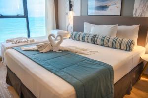 Postel nebo postele na pokoji v ubytování Hotel Água de Coco