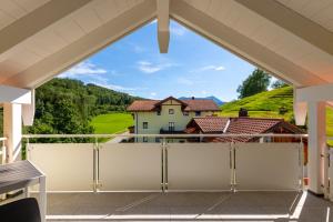 a view from the balcony of a house with a view at Siegsdorf Suiten in Siegsdorf