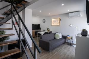 a living room with a couch and a table at Casas da Barca in Vila Nova de Foz Coa