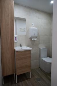 a bathroom with a sink and a toilet at Casas da Barca in Vila Nova de Foz Coa +33 photos