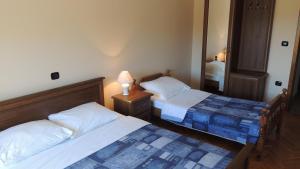 Postel nebo postele na pokoji v ubytování APARTMENT NELLY OPATIJA