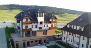 a large house with a roof on top of it at Zlatibor Hills, Top 41 in Zlatibor