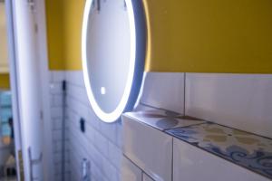 a bathroom with a sink and a mirror at Studio Reale Corfu in Corfu