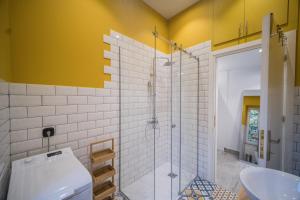 a bathroom with a toilet and a glass shower at Studio Reale Corfu in Corfu