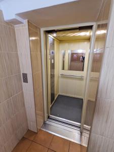 a walk in shower with a glass door in a bathroom at Comfortable and quiet flat in Central Warsaw in Warsaw