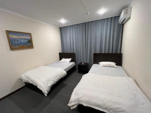 Ένα ή περισσότερα κρεβάτια σε δωμάτιο στο Koonjak