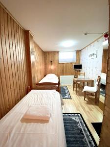 Postel nebo postele na pokoji v ubytování Lumi Guest House