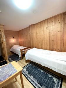 Postel nebo postele na pokoji v ubytování Lumi Guest House