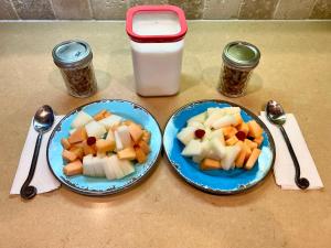 two plates of fruit and a container of milk at My Big Art Project in Santa Rosa