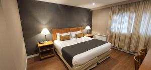 Cama ou camas em um quarto em Hotel Canal Beagle