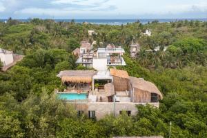 an aerial view of a house with a pool at Casa Coyote Tulum in Tulum