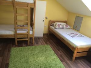 Postel nebo postele na pokoji v ubytování Hostel Jedvaj