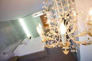 Postel nebo postele na pokoji v ubytování Boutique Hotel Imperialart