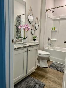 a bathroom with a sink and a toilet and a tub at Beach Room, for wonderful Vacation in Panama City Beach +21 photos