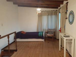 מיטה או מיטות בחדר ב-Cabañas Loma de El Pelao