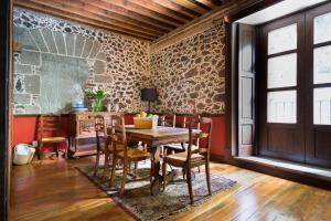 a dining room with a wooden table and chairs at CASA SAUTO SUITE CON BALCON in Mexico City